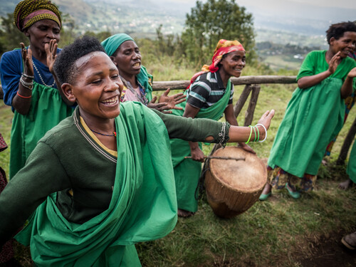September 2017. The Batwa Pygmies were evicted from their home lands in the forest in the early 1990s when the Mghinga Gorilla National Park was established, leaving them landless and poor in a society that saw them as a lower class. Today some of them try to make ends meet by hosting trail walks; cultural tours that include examples of where and how they use to live in the forest as well as singing, dancing, and handicrafts for sale. Mgahinga Gorilla National Park, Uganda. Photograph by Jason Houston for USAID.